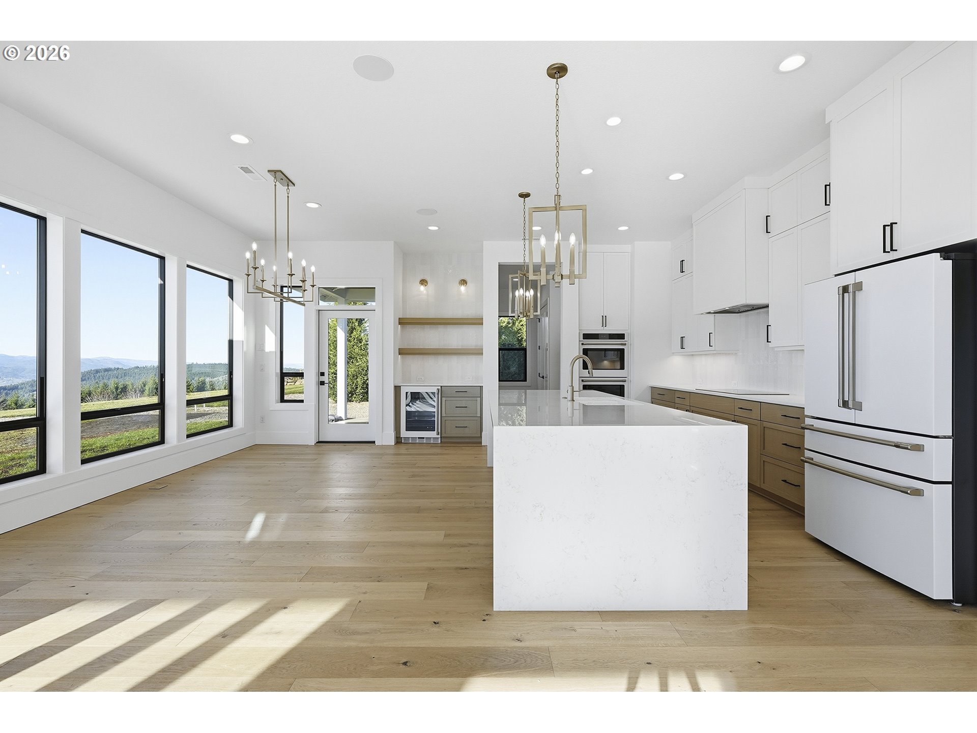 35921 Southwest Bald Peak Road Hillsboro, OR 97123 - Photo 11 of 48 a living room with stainless steel appliances kitchen island furniture and a view of kitchen