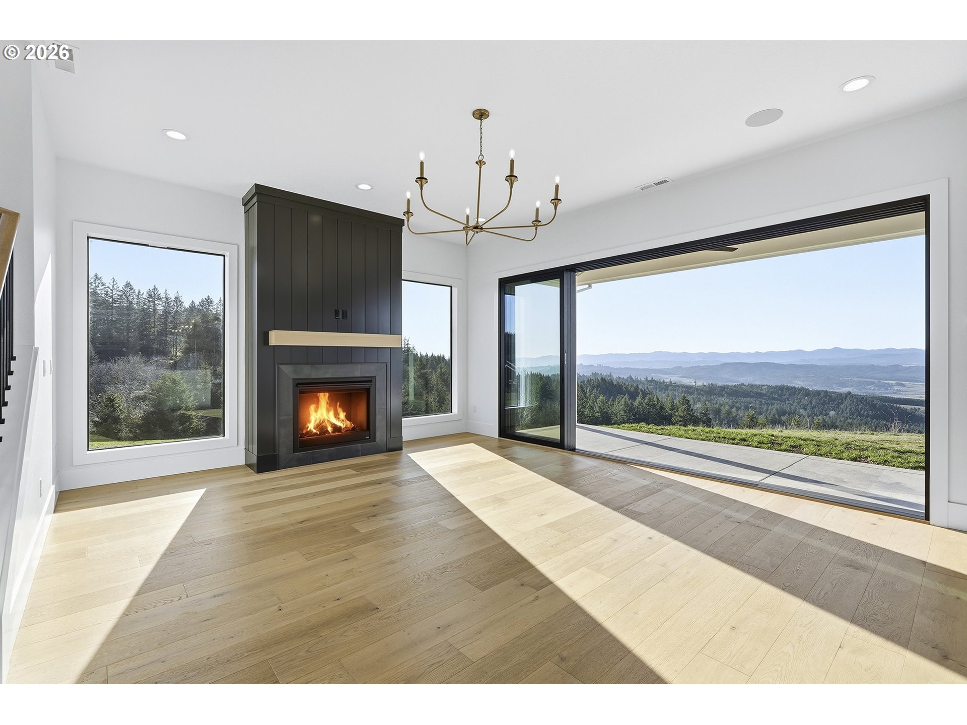 35921 Southwest Bald Peak Road Hillsboro, OR 97123 - Photo 5 of 48 a view of an empty room with a fireplace and a window