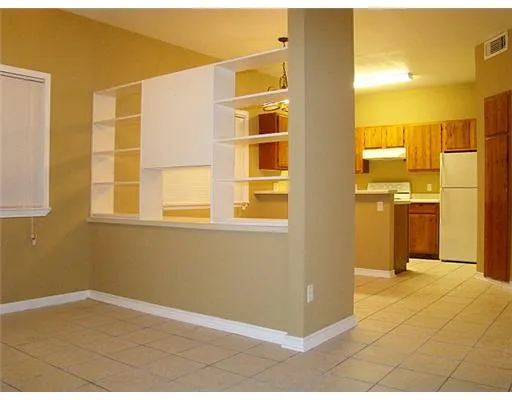 a view of a kitchen with a fridge
