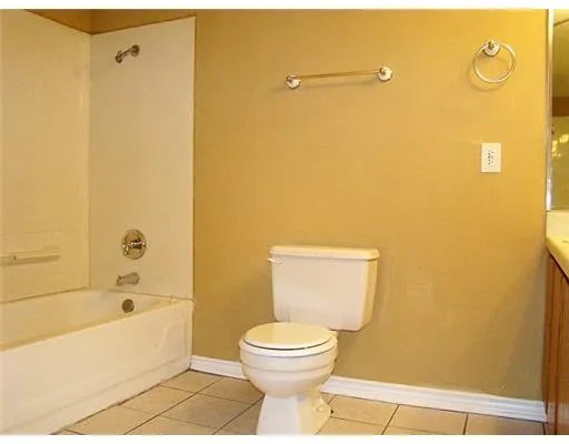 a bathroom with a toilet and a bathtub