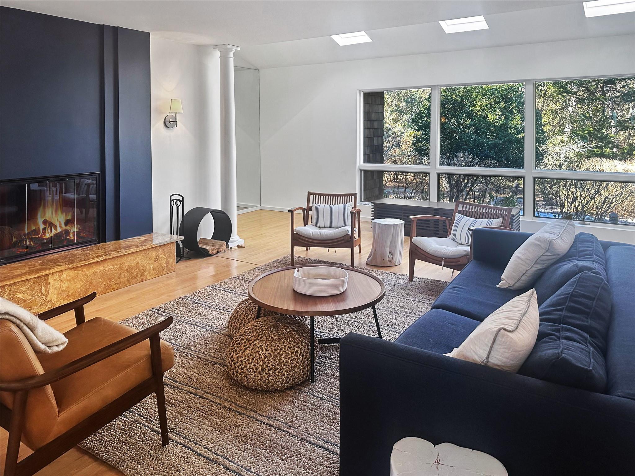 250 Pine Tree Court Cutchogue, NY 11935 - Photo 3 of 25 a living room with furniture and a fireplace