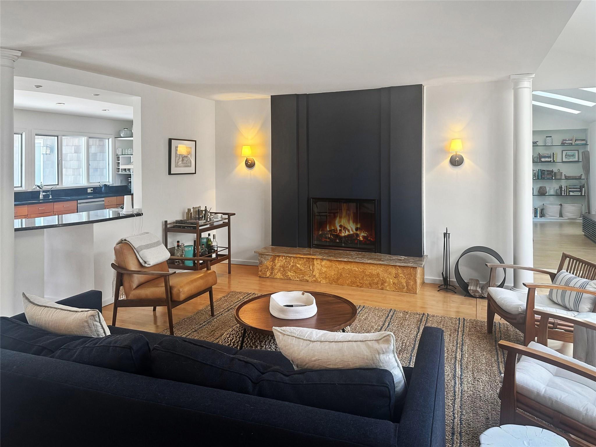 250 Pine Tree Court Cutchogue, NY 11935 - Photo 5 of 25 a living room with furniture and a fireplace