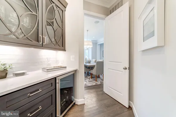 a kitchen with a table and chairs in it