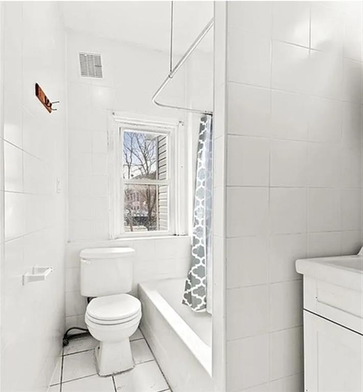 980 Lenox Road Brooklyn, NY 11212 - Photo 4 of 4 a bathroom with a toilet a sink and a shower