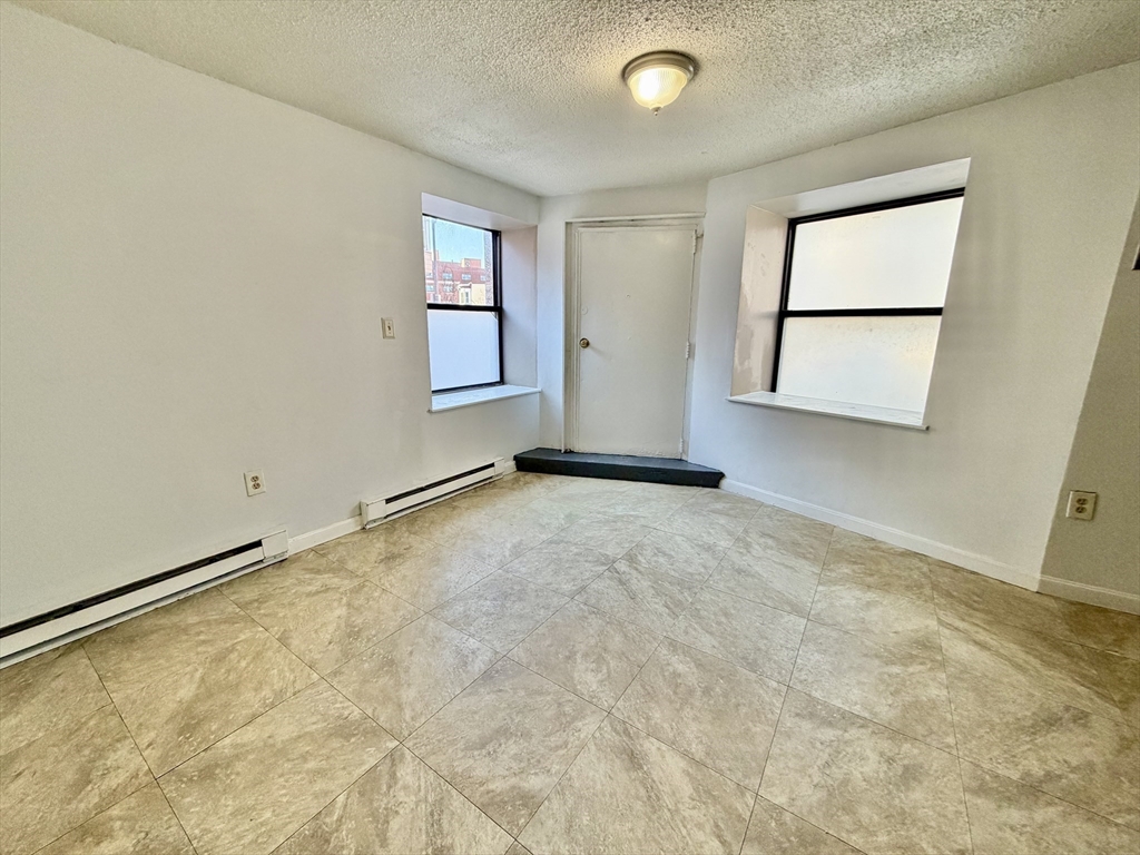379 Meridian Street, Unit 101 Boston, MA 02128 - Photo 10 of 10 an empty room with a window