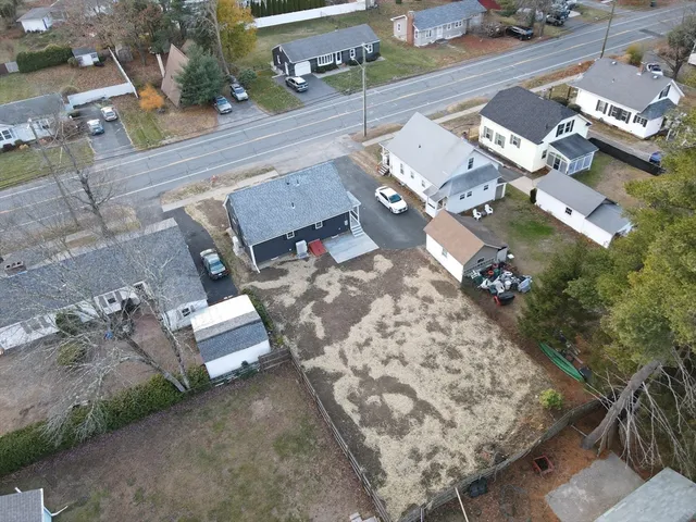an aerial view of a house with outdoor space