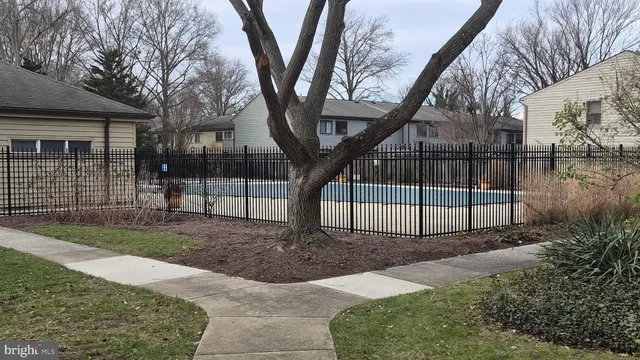 a view of a backyard with a fence