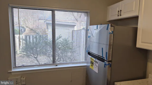 a view of a door and a window