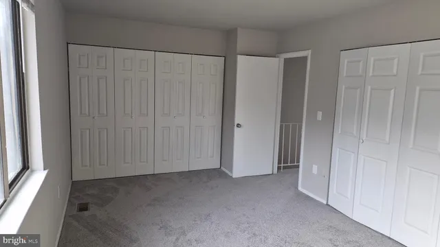 a view of a closet area with an empty room
