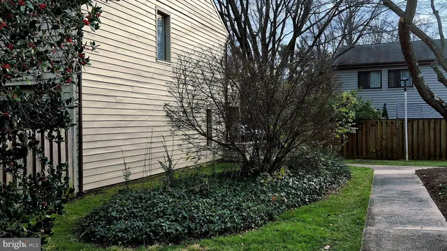a view of a pathway with a house in the background