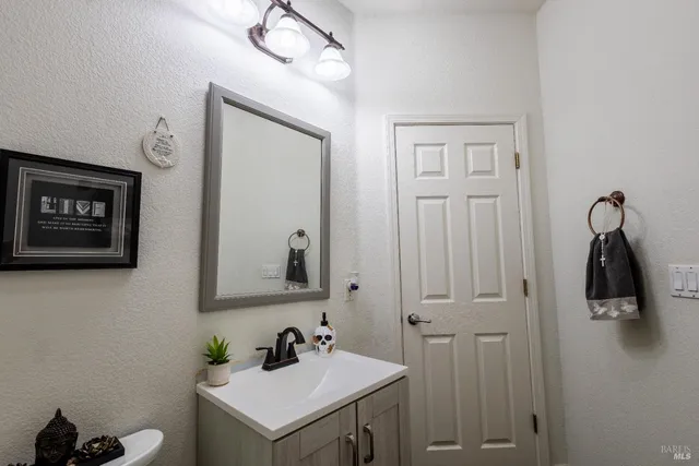a bathroom with a sink and mirror