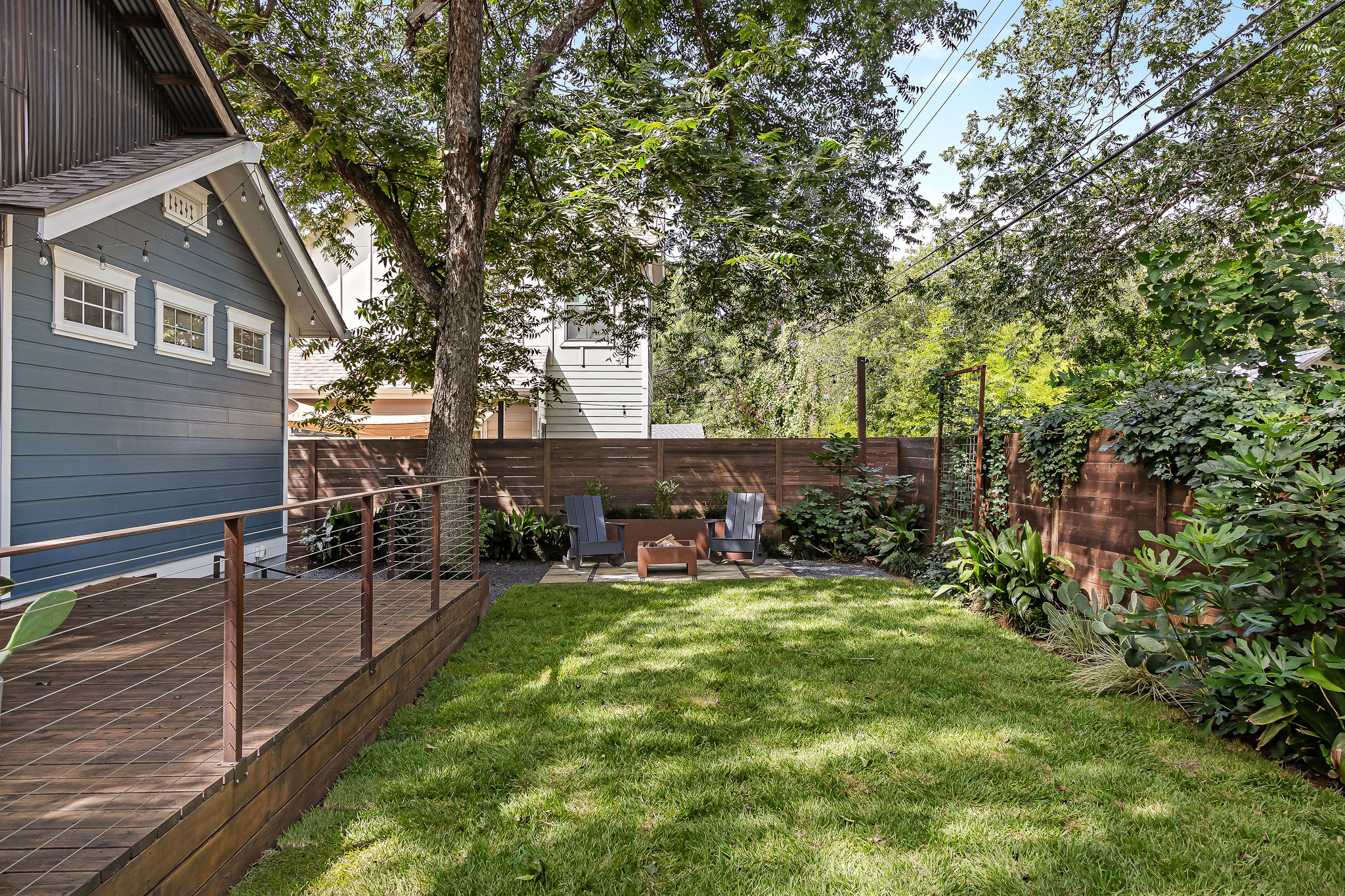 5108 Eilers Avenue Austin, TX 78751 - Photo 9 of 39 Spacious backyard with exterior deck and screened-in porch