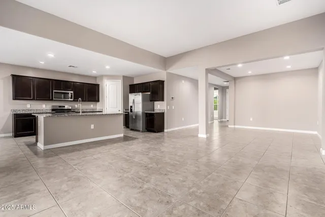 a view of a kitchen with a sink and a microwave