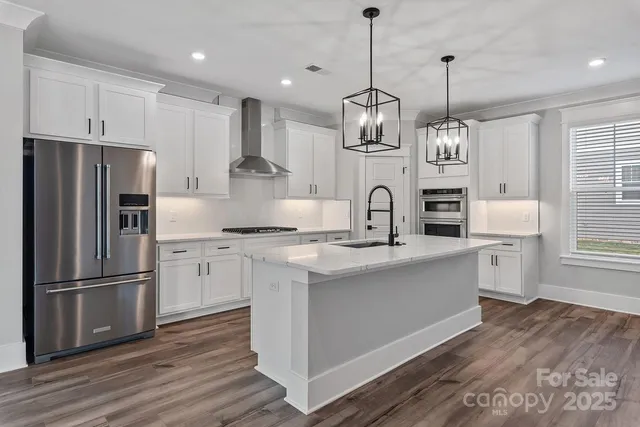 a kitchen with counter top space cabinets and stainless steel appliances