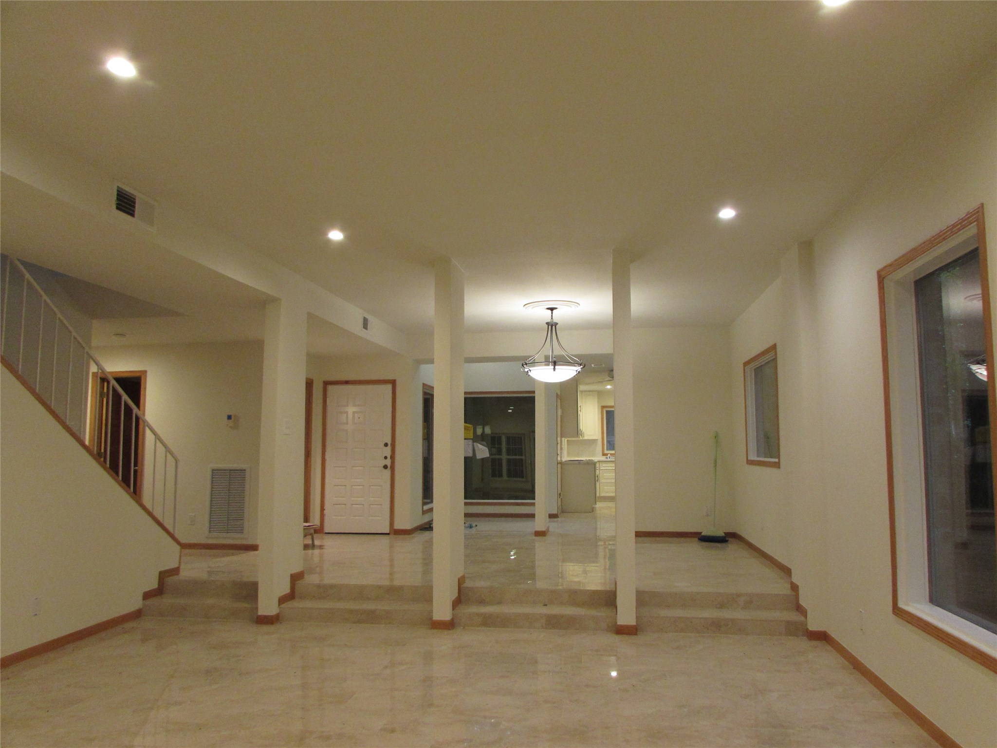 a view of a hallway with wooden shelves