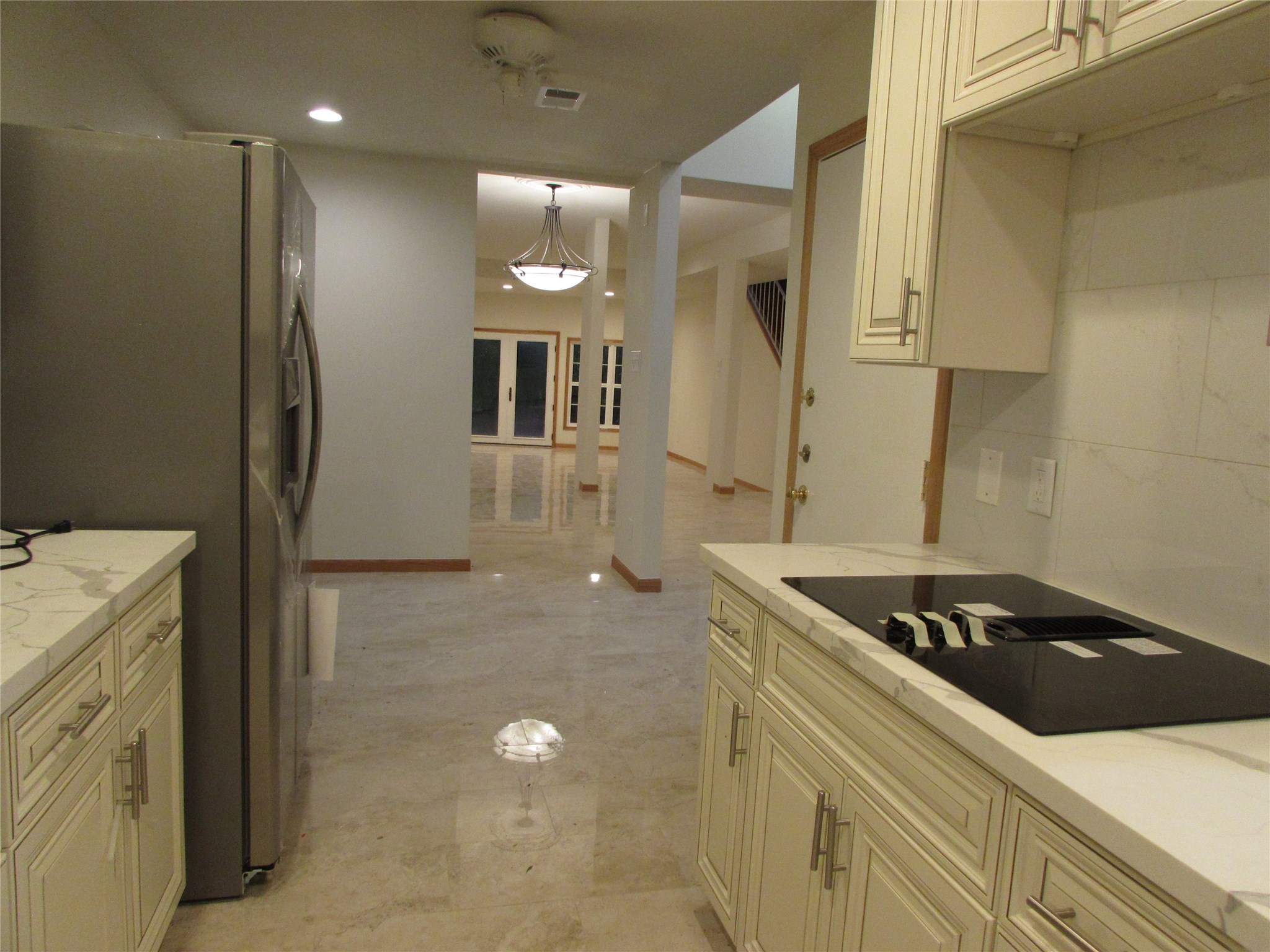 201 Vanderpool Lane, Unit 19 Houston, TX 77024 - Photo 12 of 23 a kitchen with a sink and cabinets