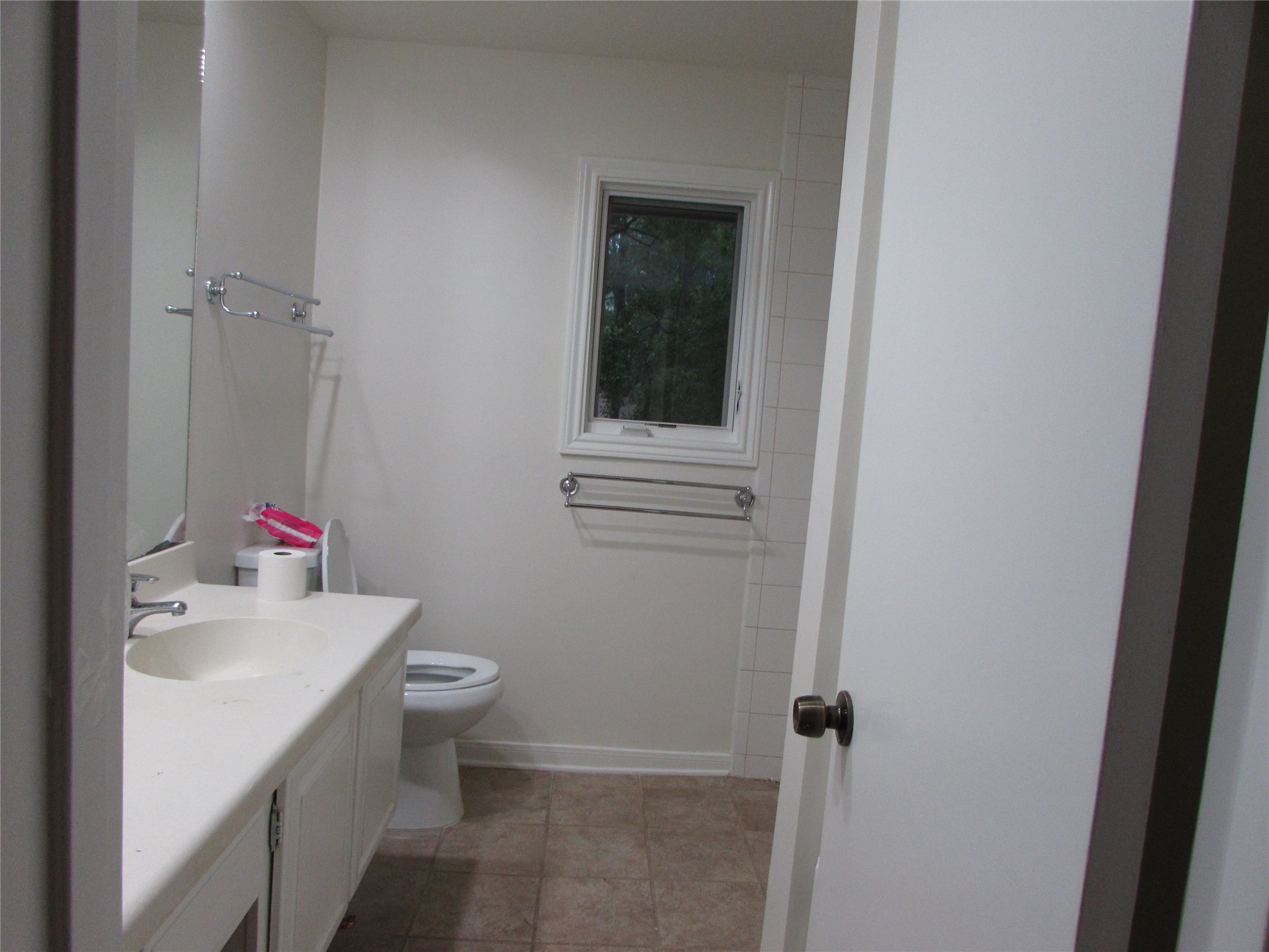 201 Vanderpool Lane, Unit 19 Houston, TX 77024 - Photo 21 of 23 a bathroom with a sink toilet and vanity