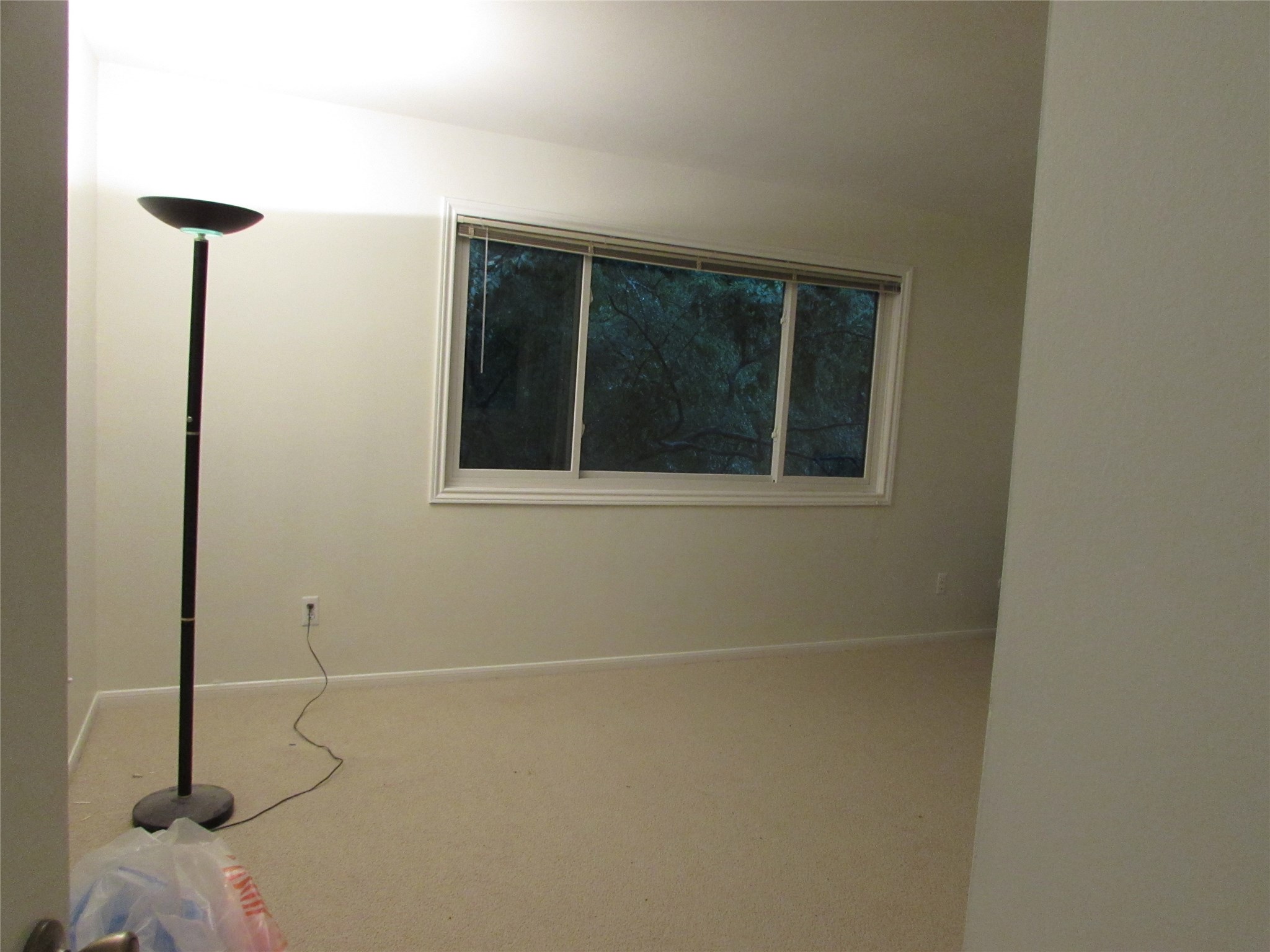 201 Vanderpool Lane, Unit 19 Houston, TX 77024 - Photo 23 of 23 a view of a small space with wooden floor and a window