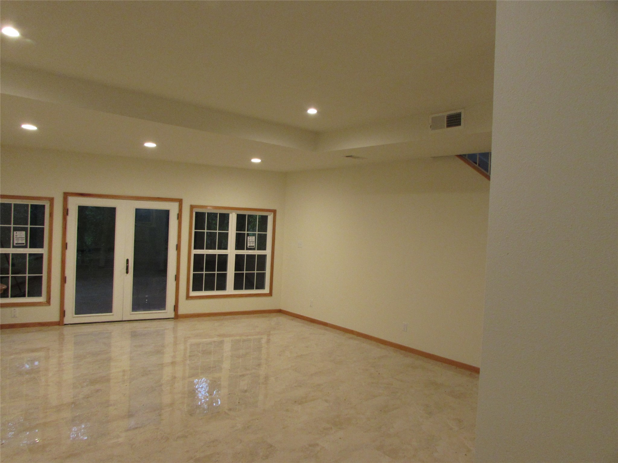 201 Vanderpool Lane, Unit 19 Houston, TX 77024 - Photo 3 of 23 an empty room with windows