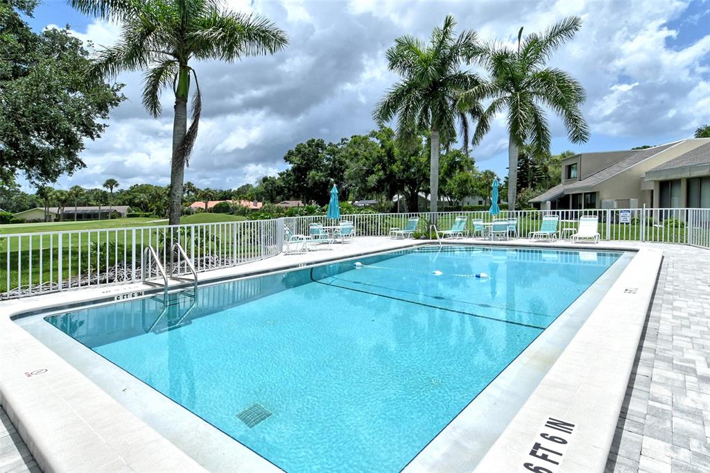 2517 Glebe Farm Close, Unit H2 Sarasota, FL 34235 - Photo 2 of 59 a view of swimming pool with a lounge chair