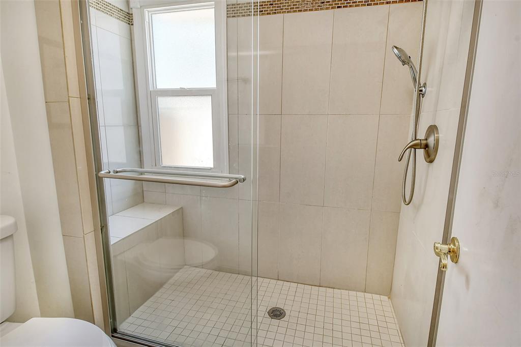 2517 Glebe Farm Close, Unit H2 Sarasota, FL 34235 - Photo 21 of 59 a bathroom with a shower