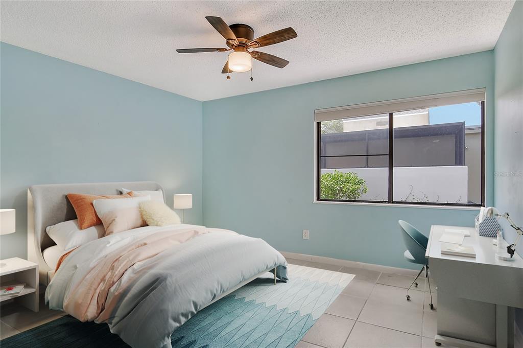 2517 Glebe Farm Close, Unit H2 Sarasota, FL 34235 - Photo 22 of 59 a bedroom with a bed and a window