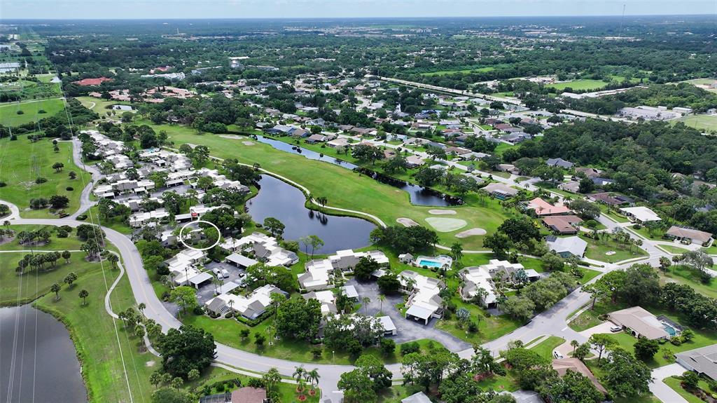 2517 Glebe Farm Close, Unit H2 Sarasota, FL 34235 - Photo 31 of 59 an aerial view of a city with lots of residential buildings