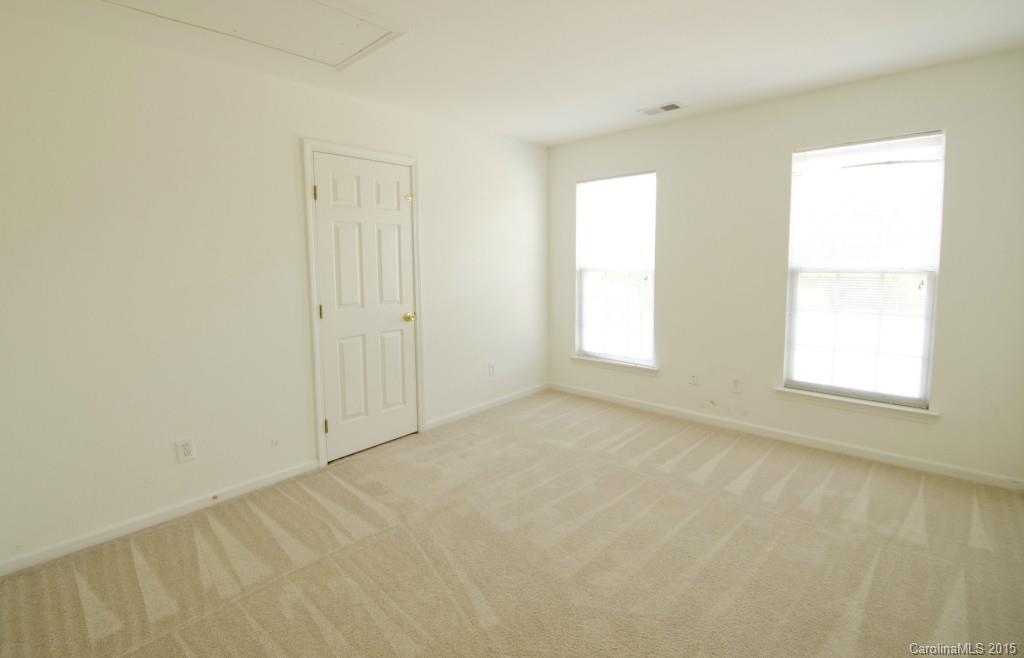 12809 Winget Road Charlotte, NC 28278 - Photo 18 of 23 an empty room with windows