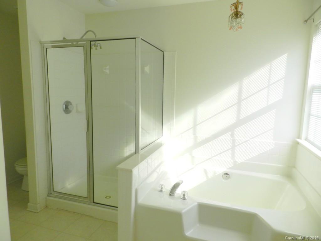 12809 Winget Road Charlotte, NC 28278 - Photo 23 of 23 a bathroom with a shower and a sink