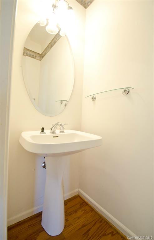 12809 Winget Road Charlotte, NC 28278 - Photo 8 of 23 a bathroom with a sink and mirror