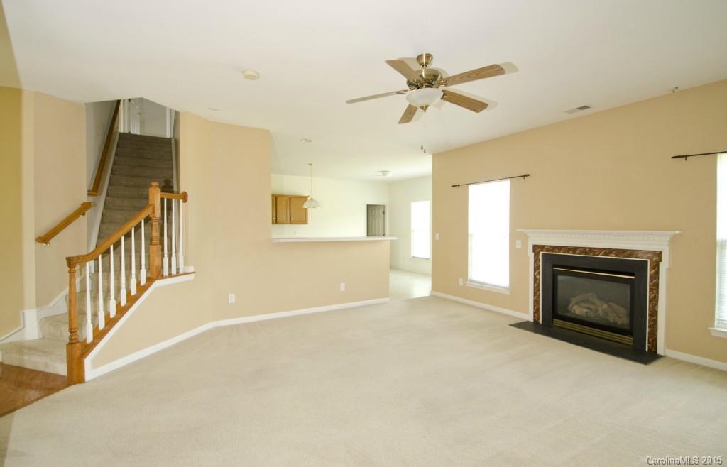 12809 Winget Road Charlotte, NC 28278 - Photo 9 of 23 a view of a livingroom with a fireplace and cabinet