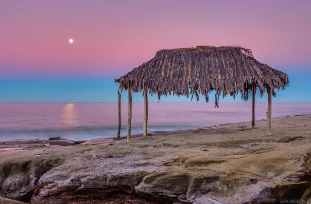 a large kitchen with kitchen island a stove a sink and a refrigerator