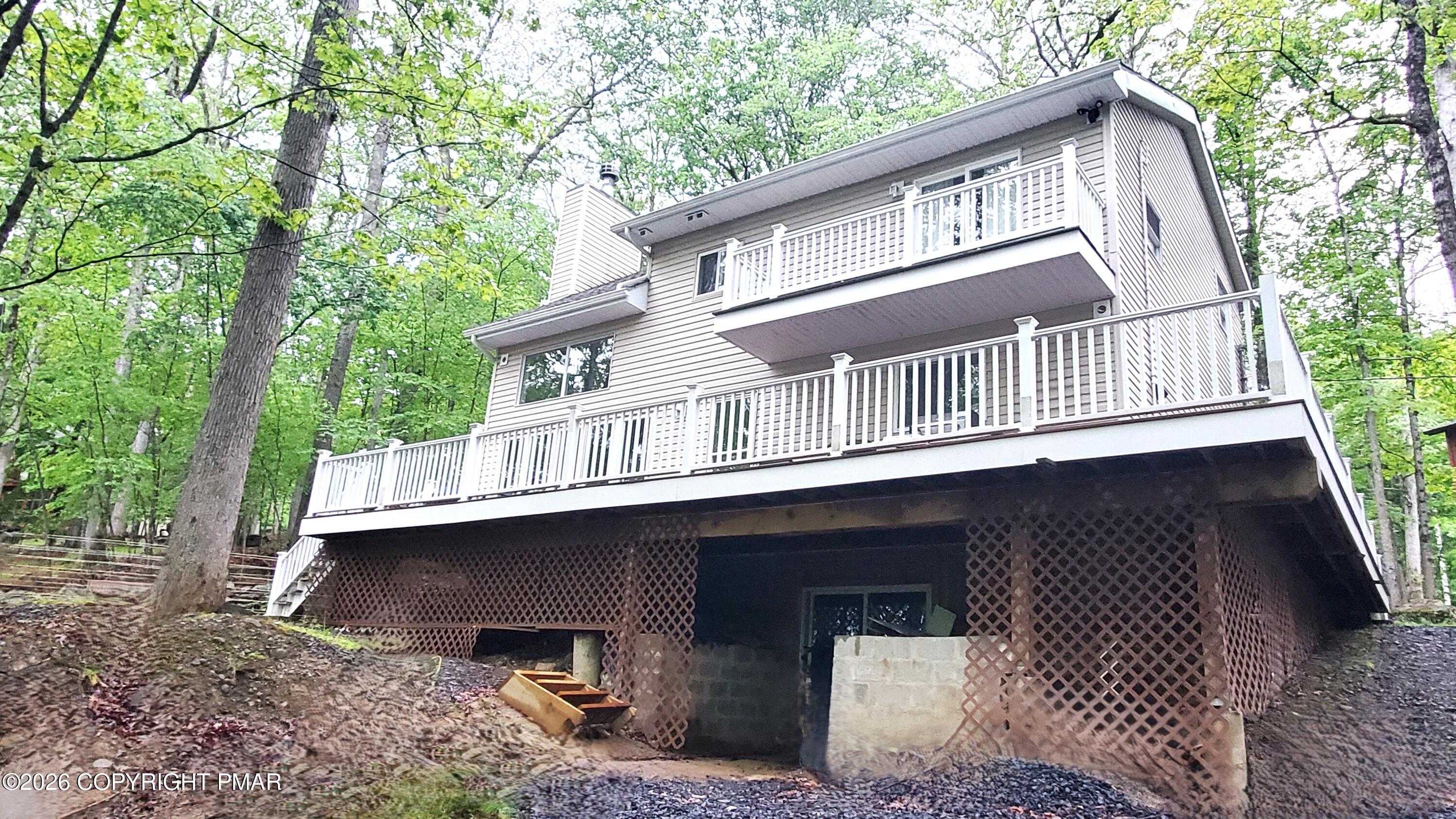 5873 Decker Road Bushkill, PA 18324 - Photo 1 of 57 a front view of a house with a balcony