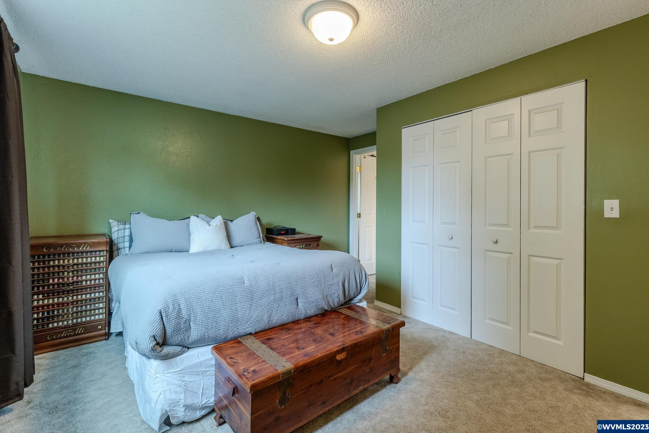 2136 15th Street Springfield, OR 97477 - Photo 26 of 38 a bedroom with a bed and a mirror