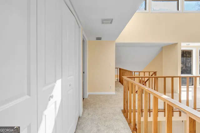 a view of a porch with a table and chairs