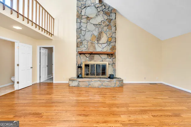 a view of balcony with wooden floor and fence