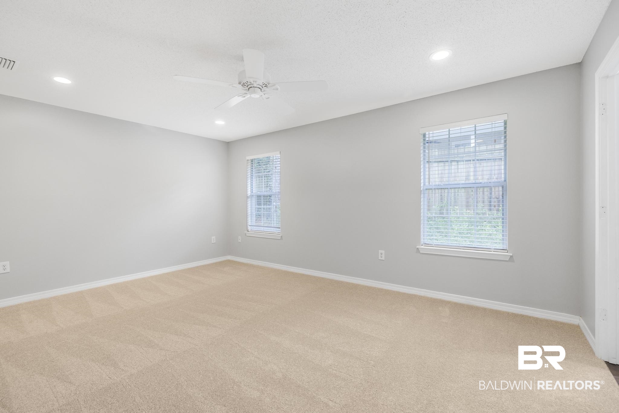 140 Hope Drive Daphne, AL 36526 - Photo 24 of 54 Empty room with light colored carpet, recessed lighting, a textured ceiling, and ceiling fan