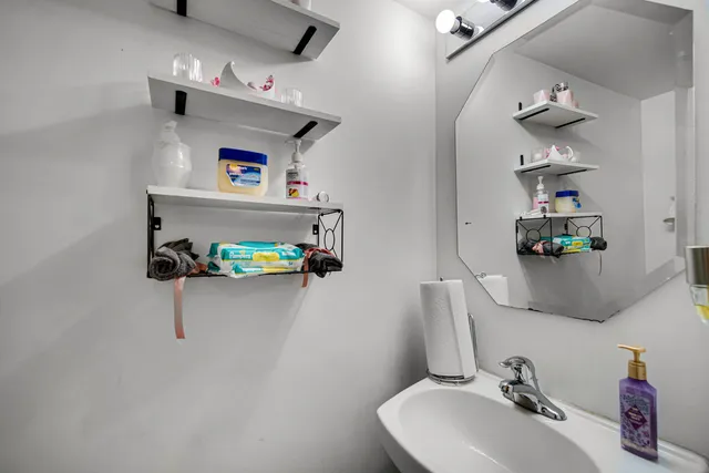 a bathroom with a sink and a mirror