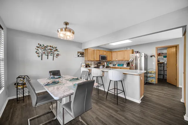 a view of a dining room with furniture and wooden floor