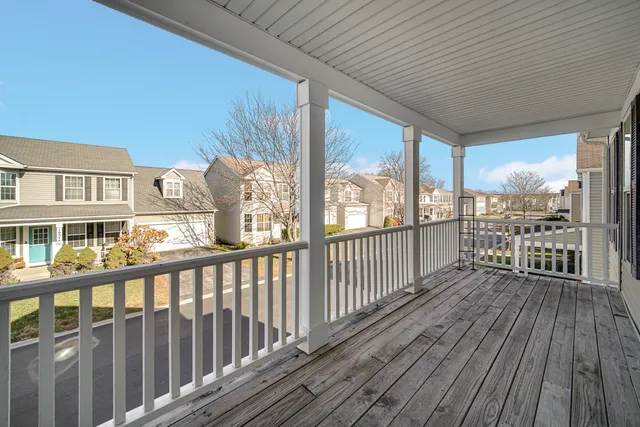 a view of a balcony with wooden floor
