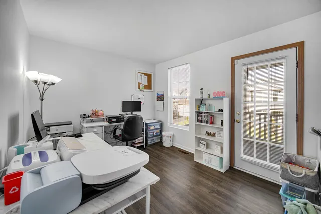 a room with furniture a flat screen tv and a window