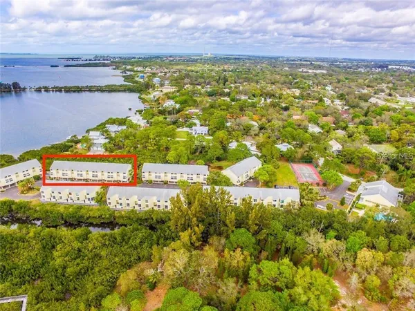 a view of a lake with a building in the background