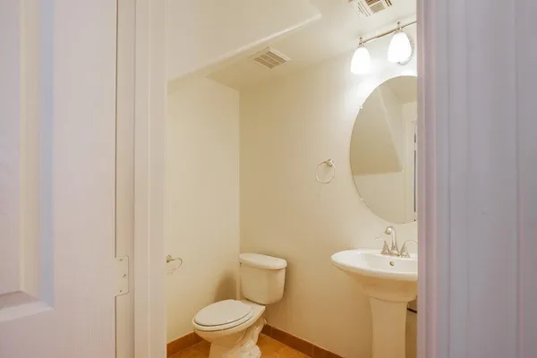 a bathroom with a toilet and a sink