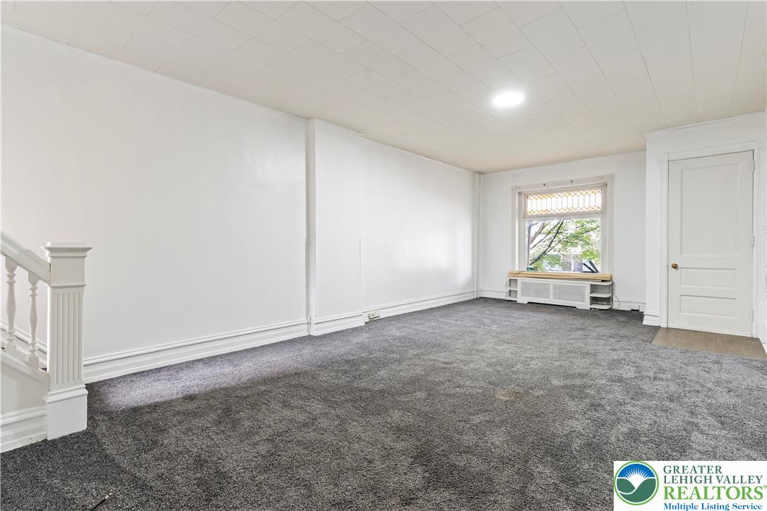 624 Cleveland Street Allentown, PA 18103 - Photo 2 of 35 an empty room with windows