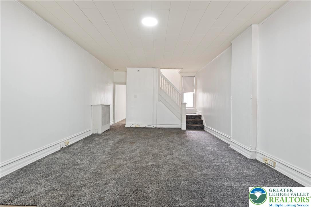 624 Cleveland Street Allentown, PA 18103 - Photo 5 of 35 an empty room with a empty space and windows