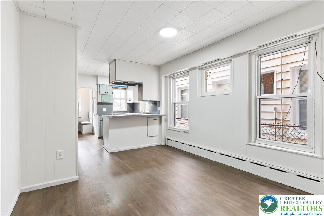 624 Cleveland Street Allentown, PA 18103 - Photo 9 of 35 a view of kitchen with window and wooden floor