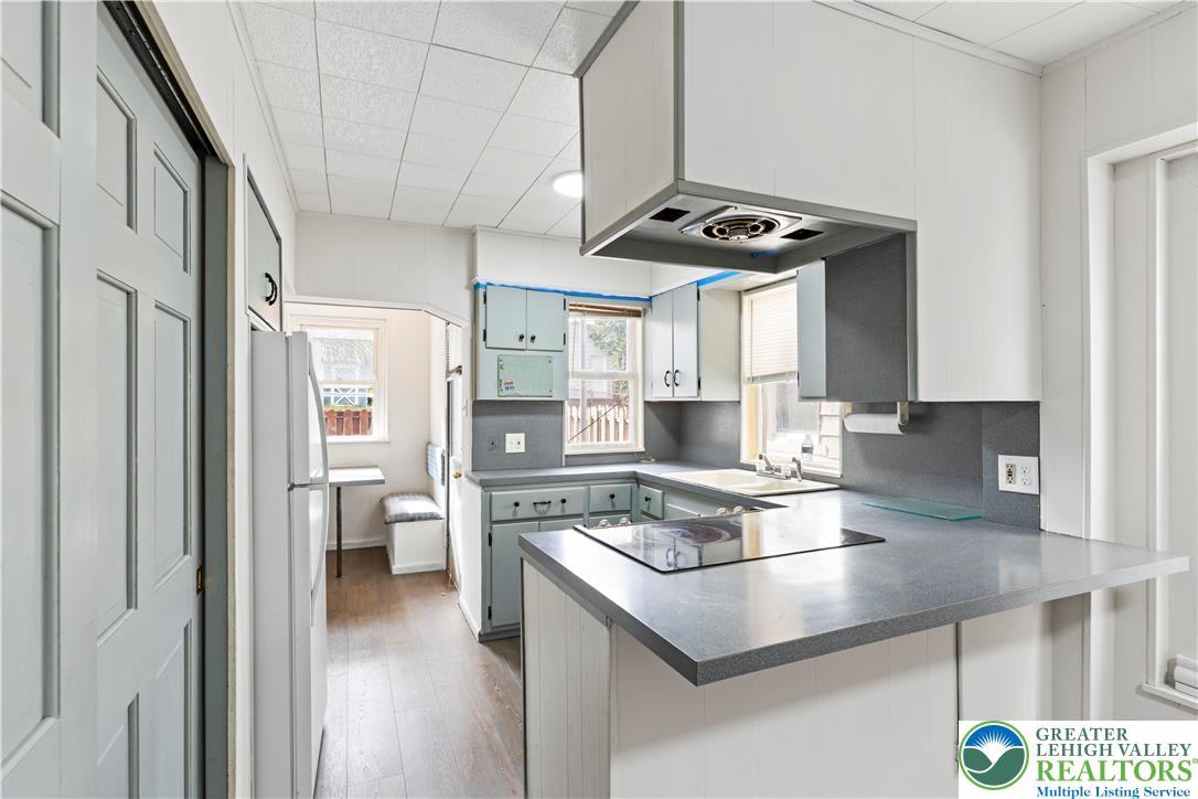 624 Cleveland Street Allentown, PA 18103 - Photo 10 of 35 a kitchen with a sink appliances and cabinets