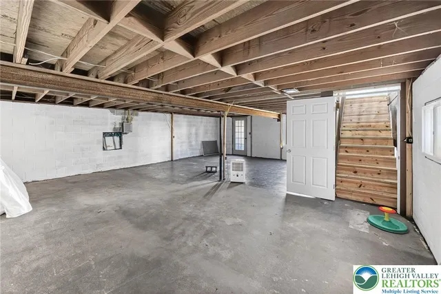 a view of a room with wooden walls