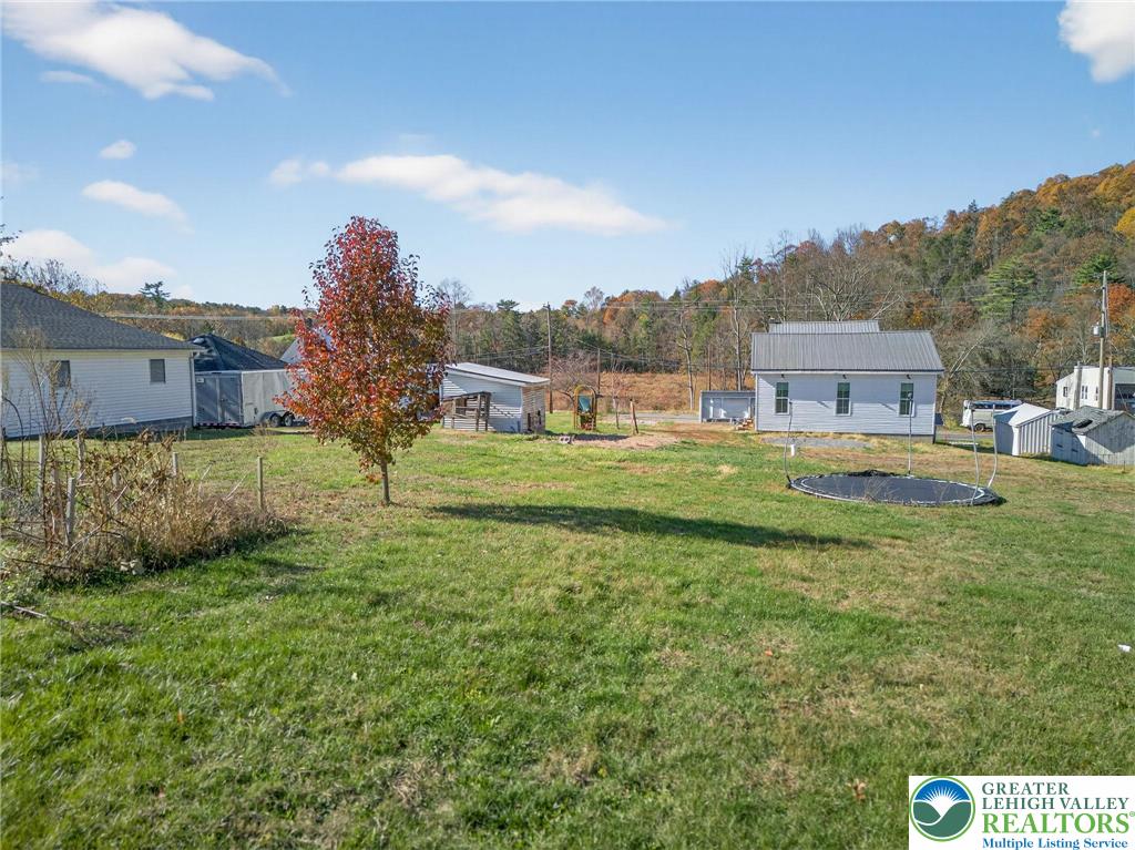 1238 Erdman Road Lykens, PA 17048 - Photo 16 of 21 a backyard of a house with table and chairs