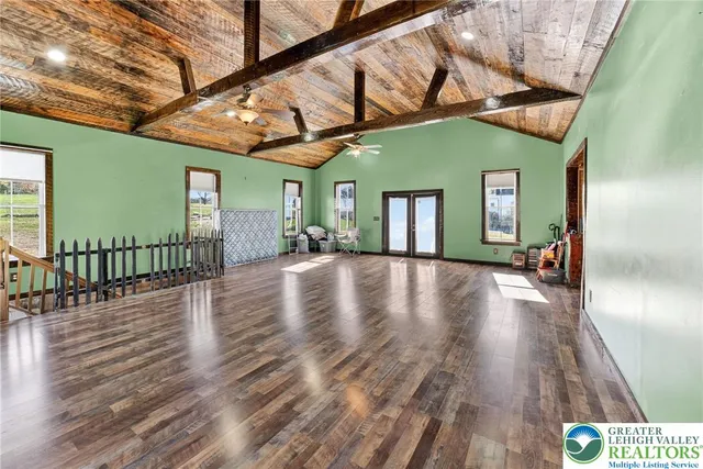 a view of a porch with wooden floor and furniture